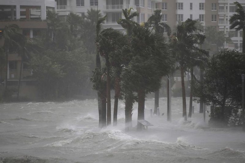 Figure 1.&nbsp;Water flows out of the Miami River to flood a walkway as Hurricane Irma passes through on September 10, 2017 in Miami, Florida. Image credit: Joe Raedle/Getty Images.