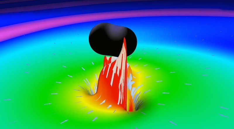 Instant of a simulation in which two black holes merge. The collision of two rotating wormholes would trigger a similar deformation of space-time, leaving 'echoes' in the signal. Credit: LIGO LabCaltech
